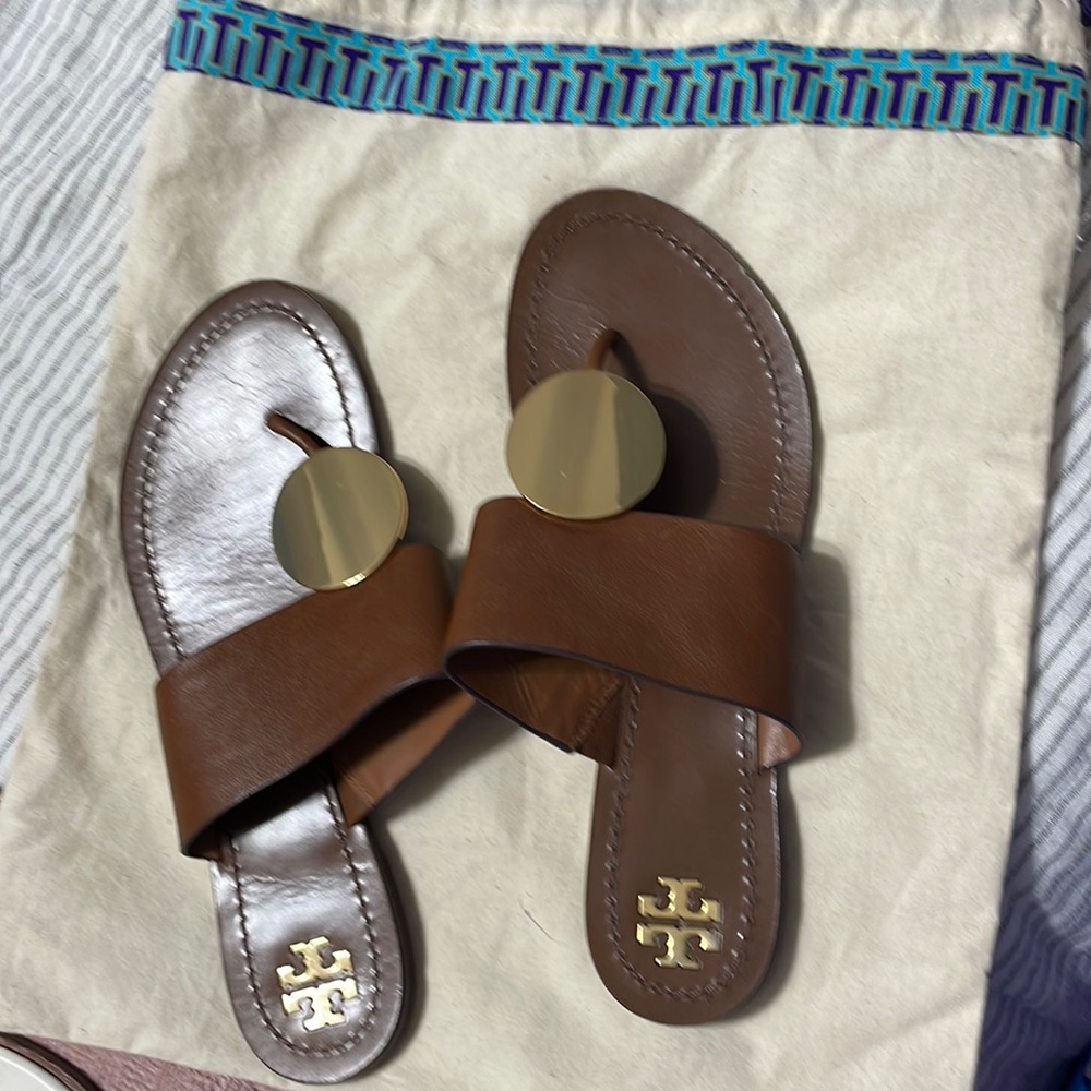 Tory Burch with gold circle sandals.